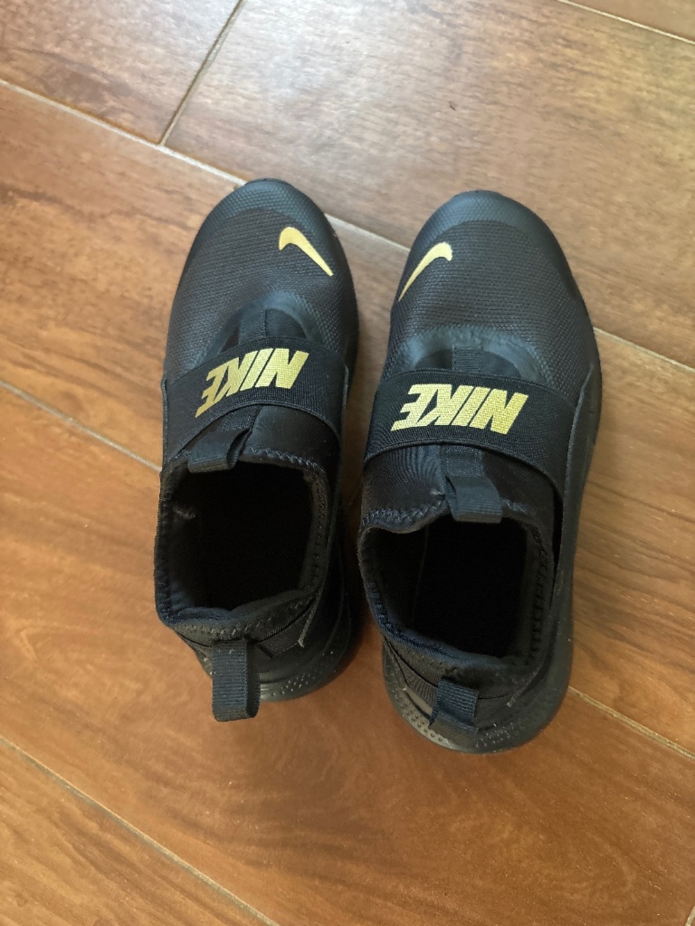 Black gold Nike shoes